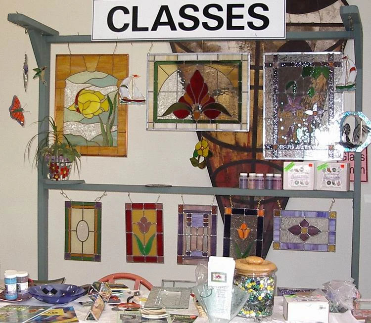 Glass pieces and materials displayed in the Glass-Smith studio